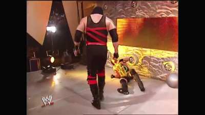 Kane chokeslams Eric Bischoff off the stage on the June 30, 2003 Raw