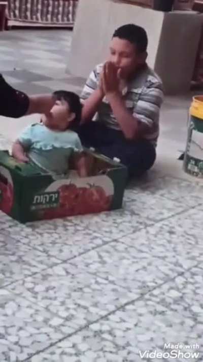 Mohammed al-Alami playing with his little sister. His father, when speaking about his son, said, 