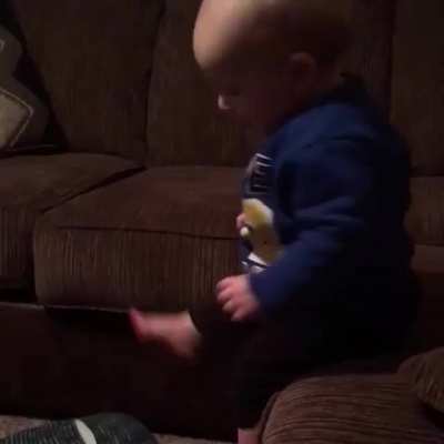 Cute child falling while playing