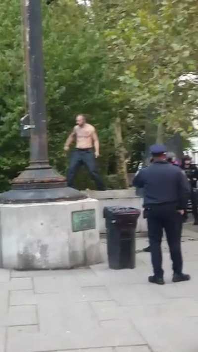 Shirtless dude freaking out at NYPD