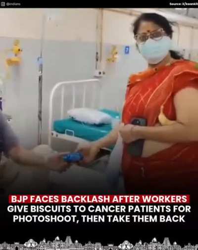 Gives biscuit to cancer patient, takes it back after pic