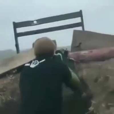 Ukraine soldiers, possibly Chechen fighters, fire a PKM at Russian militants while listening to hard bass