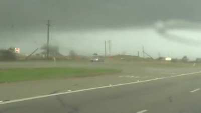 Truck gets tossed around by a tornado and causally drives away.