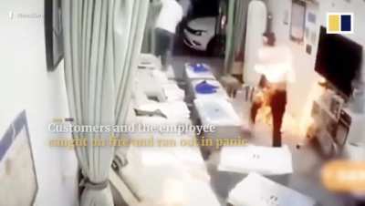 Customers and workers flee spa after alcohol burst into flames in China.