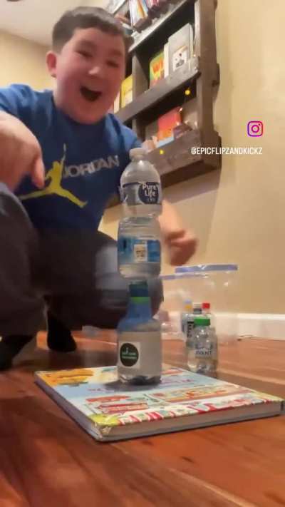 Triple bottle-flip stack.