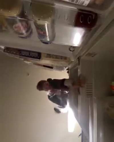 Dumbass kid falls off fridge