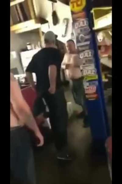 The guy in the black shirt owes the other guy $30,000 in low rider work and came to his shop to get him to stop trash-talking him