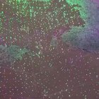 Mini fireworks. Lights reflections on puddle during rain