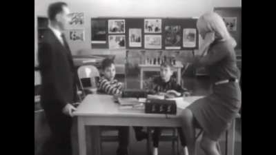 First girls, then boys, react to meeting their very attractive teacher. (1965)