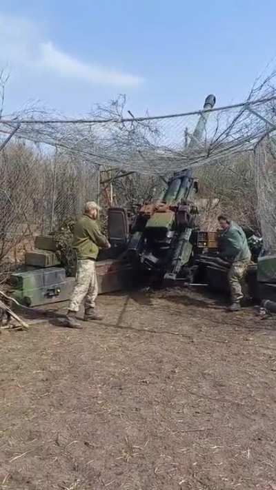 French supplied TRF-1 155mm artillery with anti-kamikaze netting fires on Russian positions, date/location unknown.