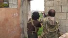 FSA fighters nearly blow each other's heads off while shooting at Pro Assad forces.