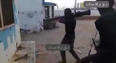 Sudanese soldier fires a recoilless gun