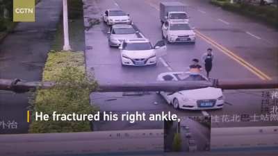 Driver survives and escapes after his car was smashed by a crane