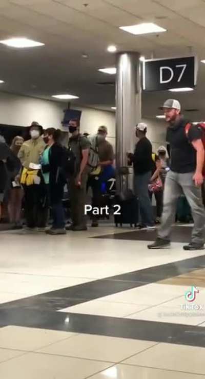 Antimask dumbfuck has a meltdown at the airport and demands that people rIsE uP!