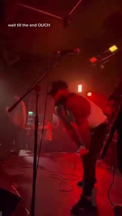 Band member greets stage hopper with roundhouse kick to the face