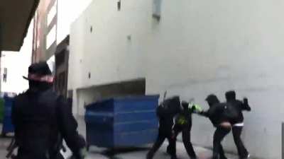 Group of antifa chase a retreating man into an alley and beat him while their comrades tried to stop journalists from filming.