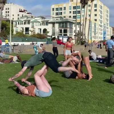 My boyfriend and I trying to fit in at yoga on the beach.
