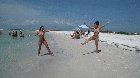 Naked cartwheels on the beach