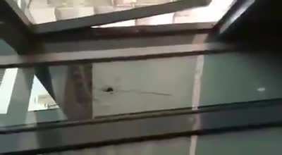 Ugandan police shoots live bullet at onlooker. A terrifying near miss.