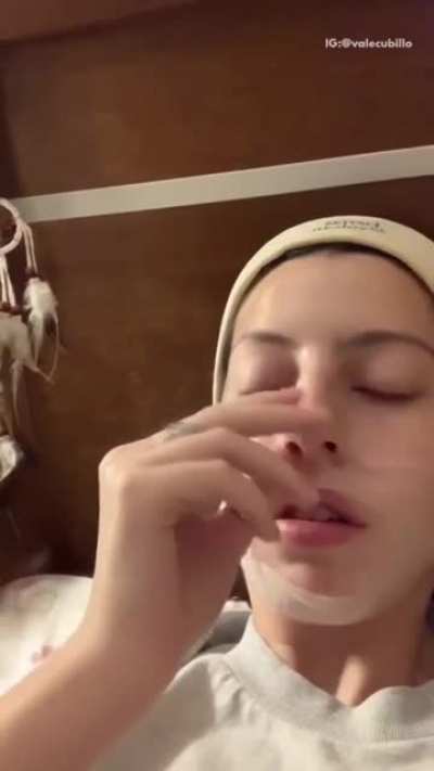 Girls wraps her nose in plastic wrap then picks at it