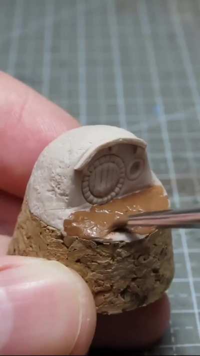 A miniature hobbit house made with polymer clay (source link in description)