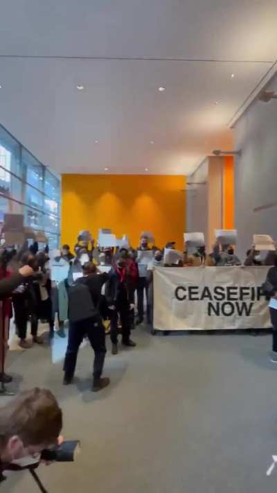 Media workers take over the lobby of the New York Times headquarters in NYC in protest of their biased coverage of Palestine.
