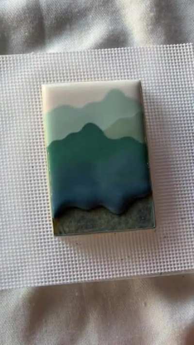 Icing a satisfying gradient on a cookie. Credit- camiscookieco
