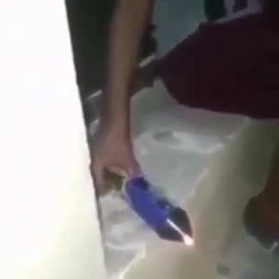 lighting a firework from the front