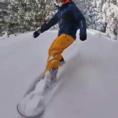 Just a guy snowboarding.