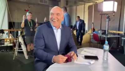 Gorden Tallis shows Michael Ennis a Magic Trick