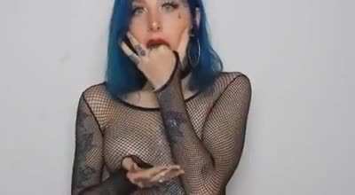 Blue Hair Light Blue Eyes Many Tatoos And A Puking Smile