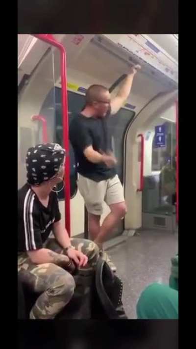 Man is being racist on the tube. Gets absolutely LAMPED