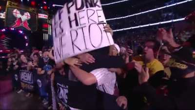pro wrestling crowd goes nuts as CM Punk returns to professional wrestling after 7 years. Wow.