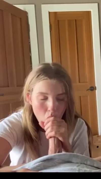 Cute blonde giving him a good BJ