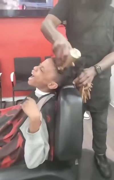 This father’s son was misbehaving so he decided to cut off his locs as punishment