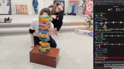 single mother plays jenga with her special needs kid