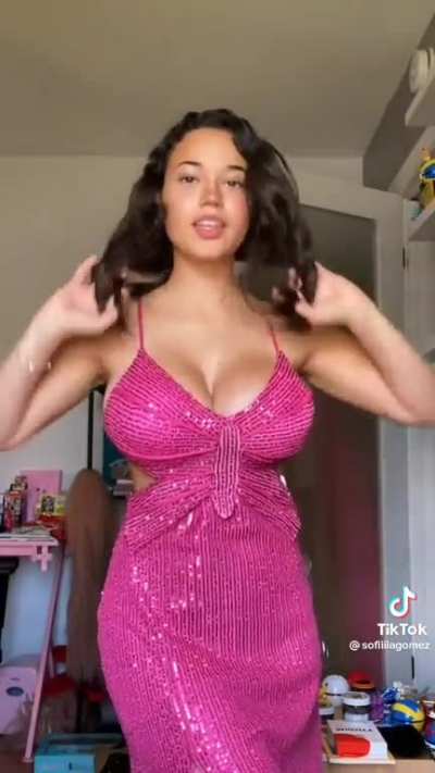 Big boobs in a pink sparkly dress