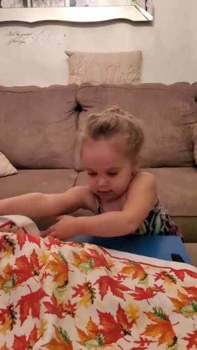 My 3 year old is now into magic tricks. This is her very first attempt, this was the simplest thing I could think of to teach her. Any suggestions on extremely simple tricks for her to practice? Thank you in advance.