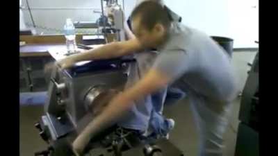 Never try to out muscle an industrial lathe.
