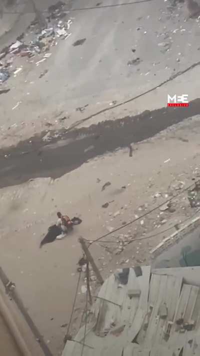 Woman holding white flag sniped in Gaza