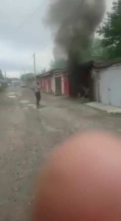 Casually wandering over to look at a shed on fire