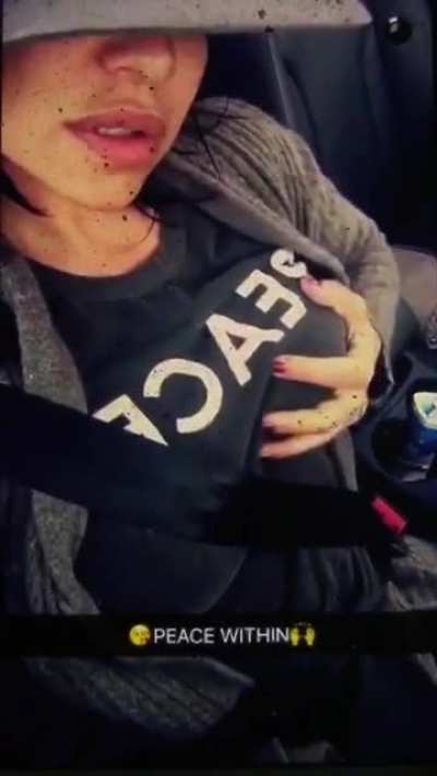 Playing with her titties