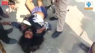 A Sikh protester getting beaten mercilessly by police and supposed 