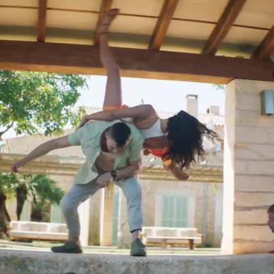 Deepika Padukone's hottest scenes from the movie 'Pathaan' - Part 2: Fighting in white top and orange bikini bottoms and sarong.