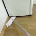 Cleaning under the fridge...
