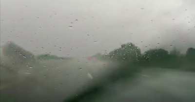 A BMW hydroplanes then flips