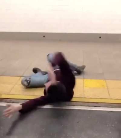 Drunk woman preventing subway doors from closing. Rider takes her for a ride.