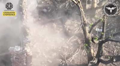 Russian soldier attempts to kick an FPV drone that is coming towards him. Video by the Strike Drones Company (47 OMBr).