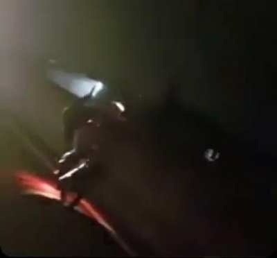 Speeding car doesn’t see biker doing wheelie