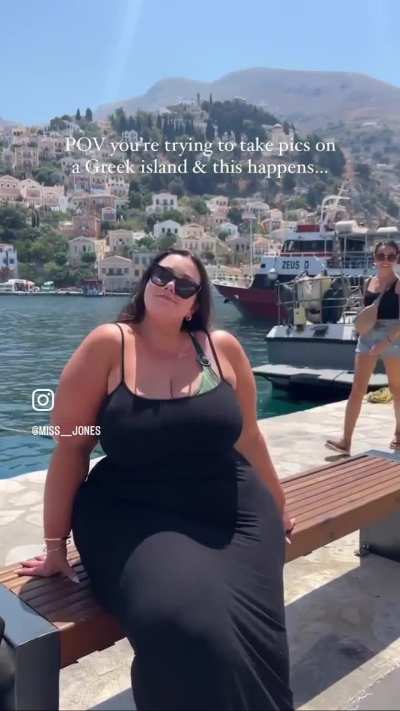 An individual walking behind someone filming in a public place = hater